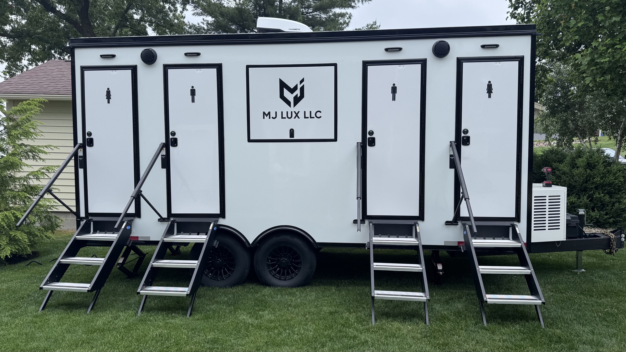4 stall luxury restroom trailer fully deployed with all four entry steps extended